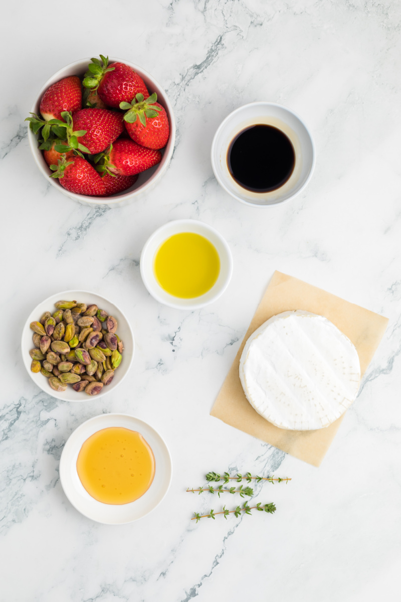 Overhead photo of ingredients needed to make roasted strawberry baked brie